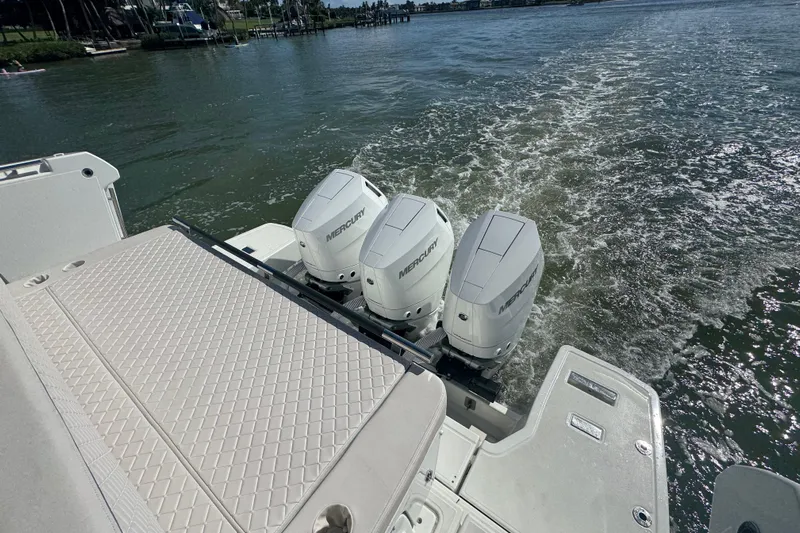  Yacht Photos Pics 2024 Jeanneau DB43 boat with triple Mercury outboard engines on water.