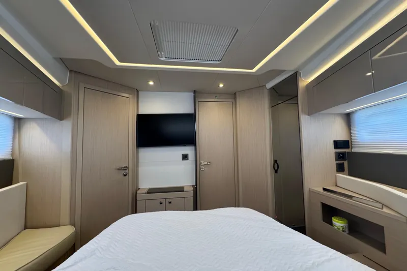  Yacht Photos Pics Luxurious interior of 2024 Jeanneau DB43 yacht cabin with modern design and ambient lighting.