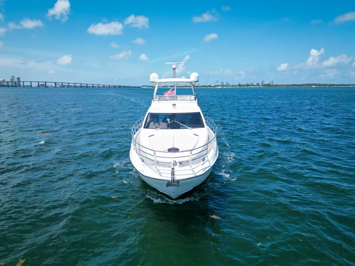  Yacht Photos Pics 2015 Azimut 54 Fly yacht cruising on open water under a clear blue sky.