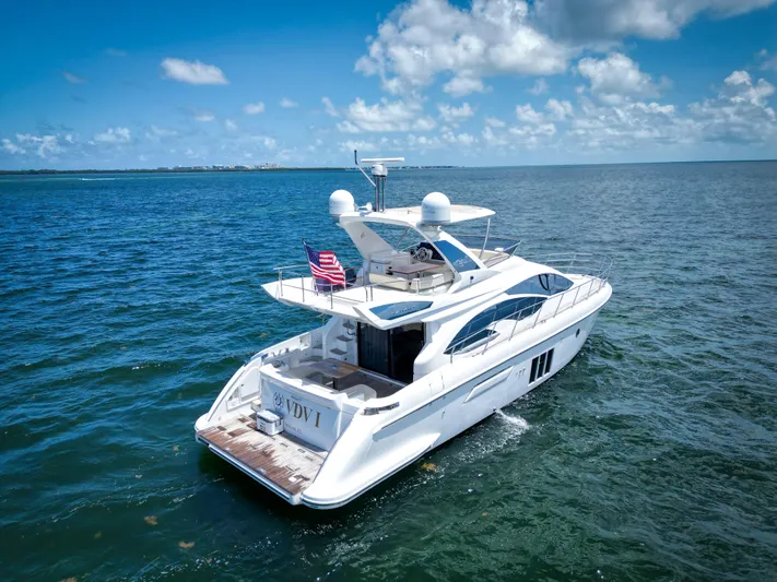  Yacht Photos Pics 2015 Azimut 54 Fly yacht cruising on open water under a clear blue sky.