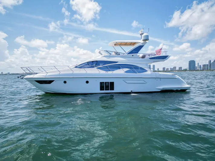  Yacht Photos Pics 2015 Azimut 54 Fly yacht on water with city skyline in background.