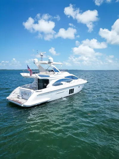  Yacht Photos Pics 2015 Azimut 54 Fly yacht cruising on open water under a clear blue sky.