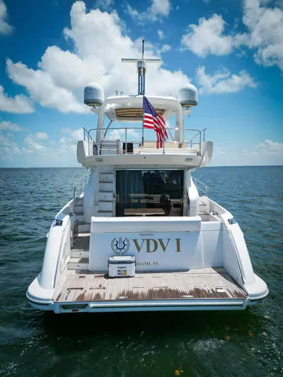  Yacht Photos Pics Azimut 54 Fly 2015 yacht on open water, rear view with American flag.