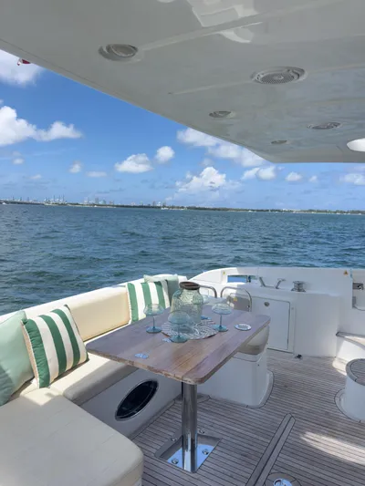  Yacht Photos Pics Luxurious 2015 Azimut 54 Fly yacht deck with seating, table, and ocean view.