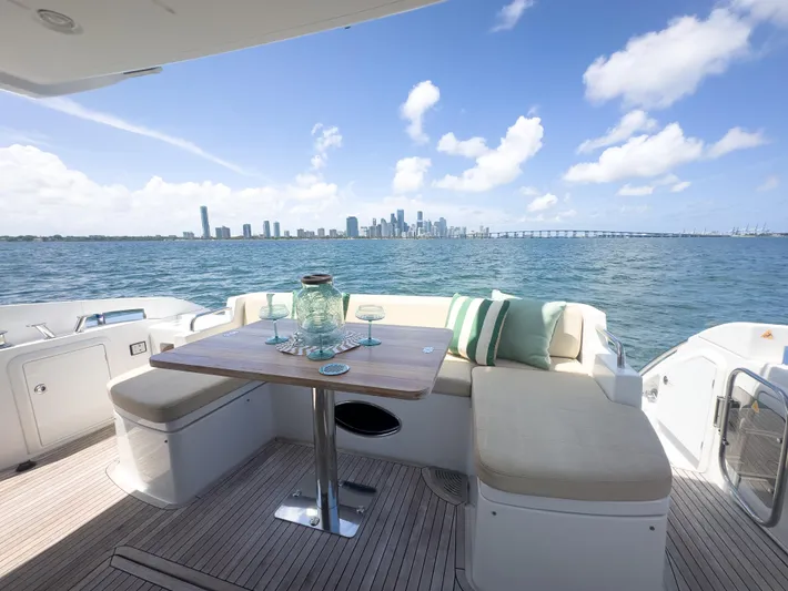  Yacht Photos Pics Azimut 54 Fly 2015 yacht deck with seating, table, and ocean view.