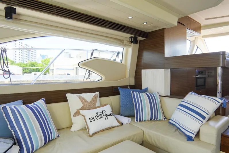  Yacht Photos Pics Luxurious interior of 2015 Azimut 54 Fly yacht with striped cushions and modern decor.