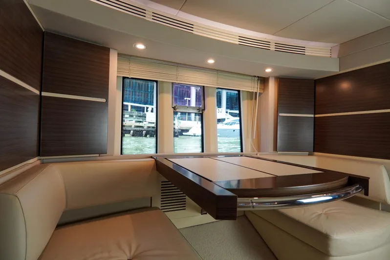  Yacht Photos Pics Luxurious interior of 2015 Azimut 54 Fly yacht with elegant seating and window view.