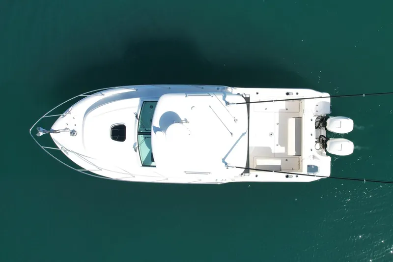 Strike Zone Yacht Photos Pics Overhead view of 2018 Boston Whaler 315 Conquest boat on clear water.