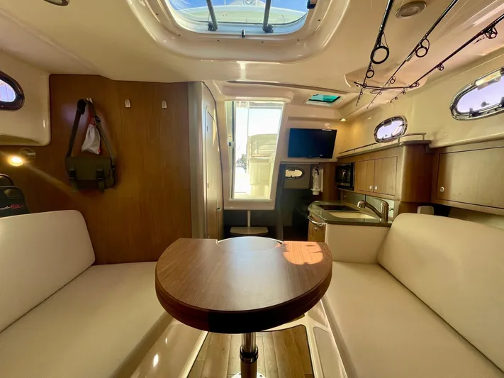 Strike Zone Yacht Photos Pics Interior of 2018 Boston Whaler 315 Conquest, featuring cozy seating and modern amenities.