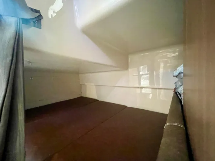 Strike Zone Yacht Photos Pics Interior cabin of 2018 Boston Whaler 315 Conquest, featuring cozy sleeping area.