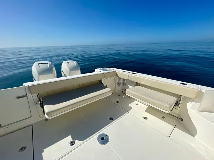 Strike Zone Yacht Photos Pics 2018 Boston Whaler 315 Conquest boat deck with ocean view and dual engines.