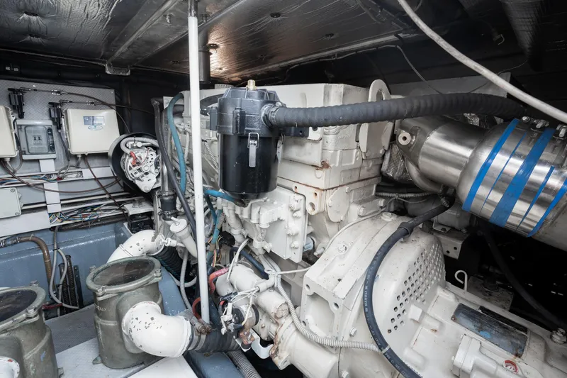 Gabriella Yacht Photos Pics Engine room of 2001 Uniesse 48 Open yacht, showcasing mechanical components and wiring.