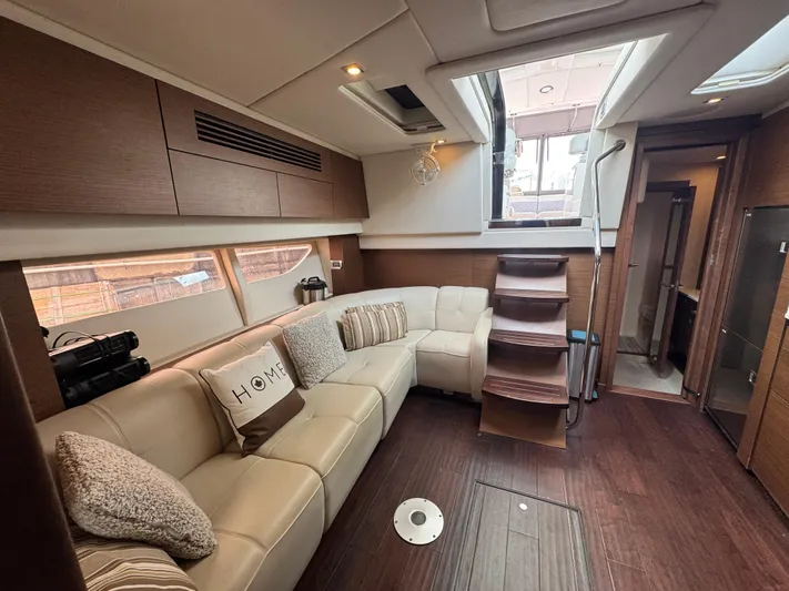  Yacht Photos Pics Luxurious interior of 2013 Sea Ray 470 Sundancer yacht with plush seating and modern design.