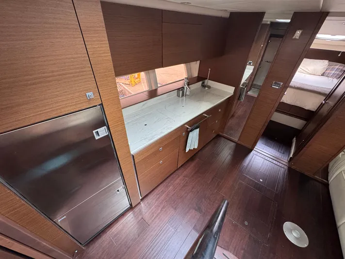  Yacht Photos Pics Luxurious interior of 2013 Sea Ray 470 Sundancer yacht with modern kitchen and wood finishes.