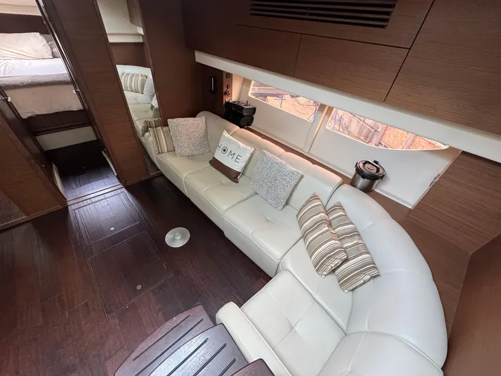  Yacht Photos Pics Luxurious interior of 2013 Sea Ray 470 Sundancer yacht with plush seating and elegant decor.