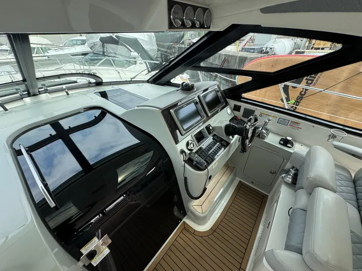  Yacht Photos Pics 2013 Sea Ray 470 Sundancer helm with modern controls and navigation systems.