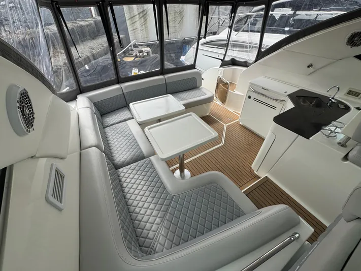  Yacht Photos Pics Luxurious interior of 2013 Sea Ray 470 Sundancer yacht with elegant seating and modern amenities.