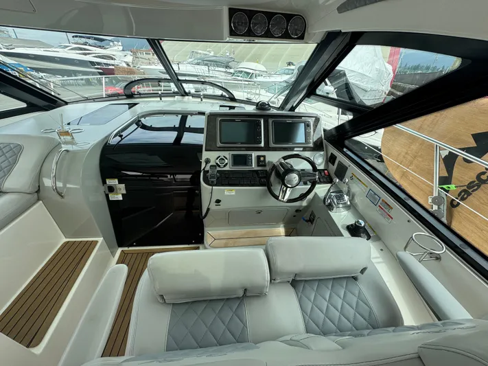  Yacht Photos Pics 2013 Sea Ray 470 Sundancer helm with modern controls and dual displays.