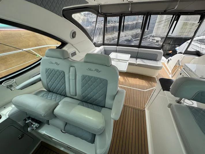  Yacht Photos Pics Luxurious interior of 2013 Sea Ray 470 Sundancer yacht with plush seating and elegant design.