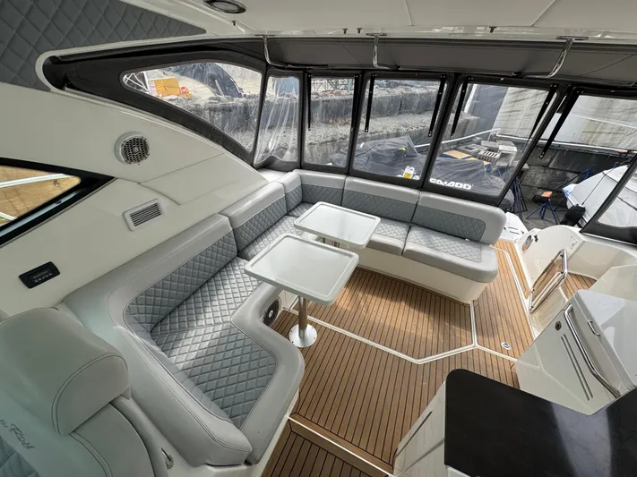  Yacht Photos Pics Luxurious interior of 2013 Sea Ray 470 Sundancer yacht with elegant seating and wood flooring.