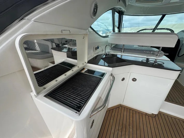  Yacht Photos Pics Luxurious 2013 Sea Ray 470 Sundancer yacht interior with sleek kitchen and seating area.