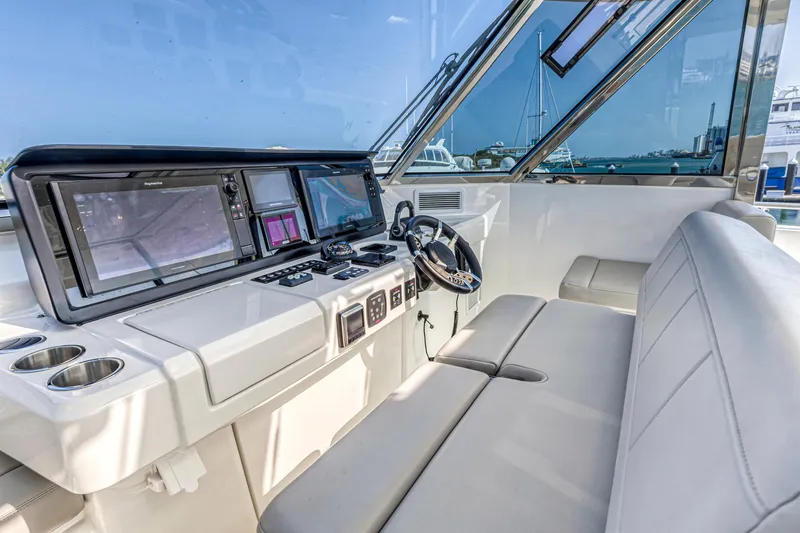  Yacht Photos Pics 2023 Aquila 54 Yacht helm with modern navigation systems and comfortable seating.