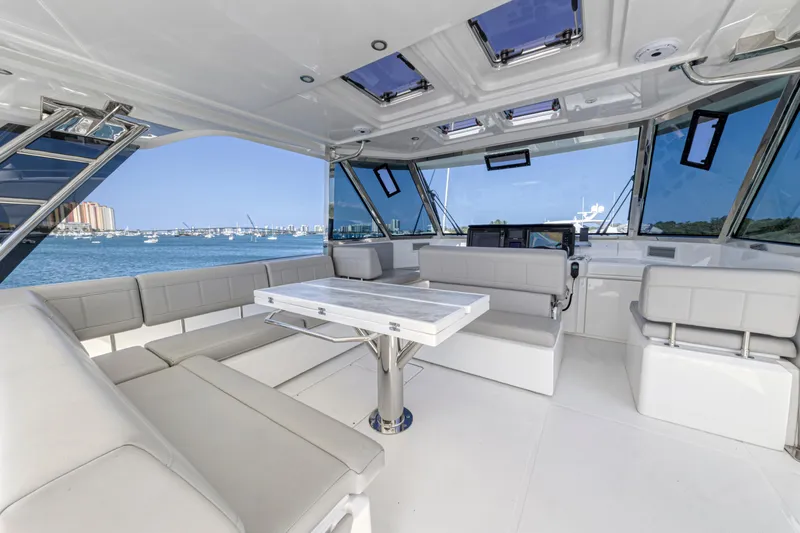  Yacht Photos Pics Luxurious interior of 2023 Aquila 54 Yacht with spacious seating and ocean view.