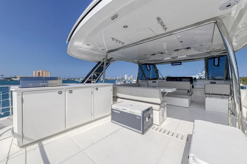  Yacht Photos Pics Luxurious 2023 Aquila 54 Yacht interior with modern seating and ocean view.