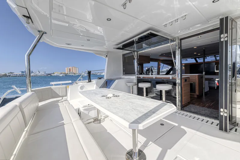  Yacht Photos Pics Luxurious 2023 Aquila 54 Yacht with spacious deck and modern interior design.