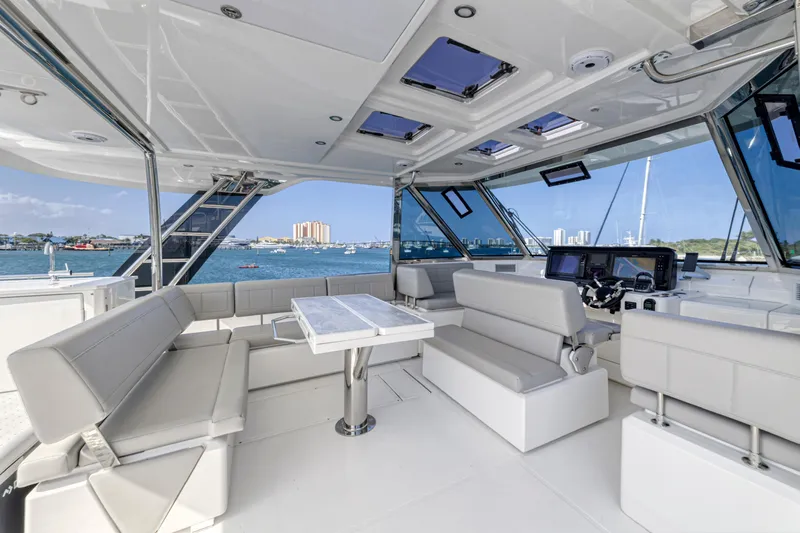  Yacht Photos Pics Luxurious interior of 2023 Aquila 54 Yacht with modern seating and panoramic windows.