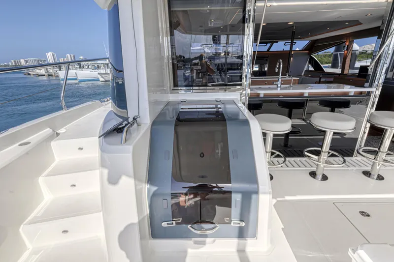  Yacht Photos Pics Aquila 54 Yacht 2023, featuring sleek design and modern interior with bar stools.