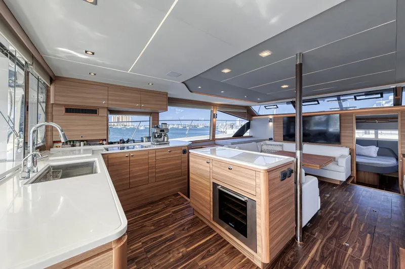  Yacht Photos Pics Luxurious interior of 2023 Aquila 54 Yacht with modern kitchen and spacious seating area.