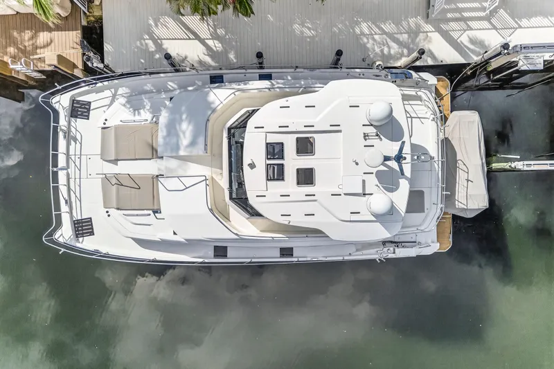  Yacht Photos Pics Top view of 2023 Aquila 54 Yacht docked, showcasing spacious deck and sleek design.