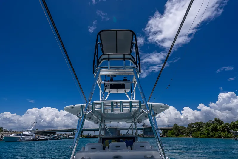 Clean Trade-ins Accepted - Bring Offers Yacht Photos Pics 2021 Contender 44 CB boat on blue water under a clear sky.