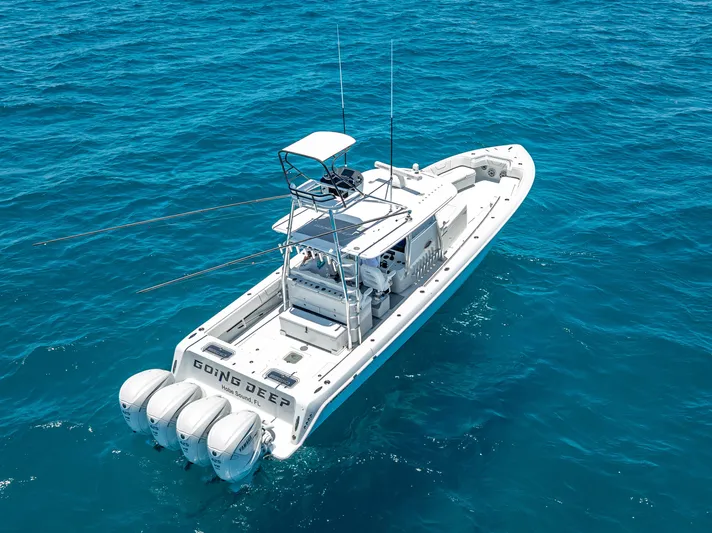 Clean Trade-ins Accepted - Bring Offers Yacht Photos Pics 2021 Contender 44 CB boat with four engines on open ocean.