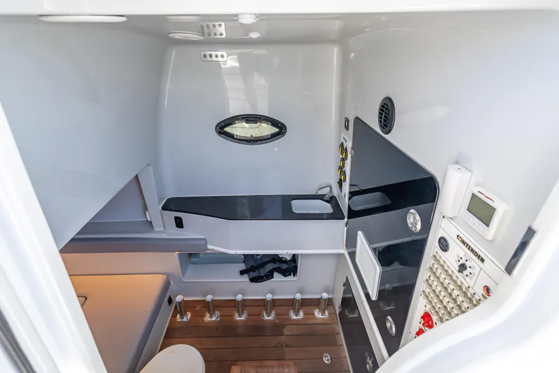 Clean Trade-ins Accepted - Bring Offers Yacht Photos Pics Interior of 2021 Contender 44 CB boat, featuring modern controls and sleek design.