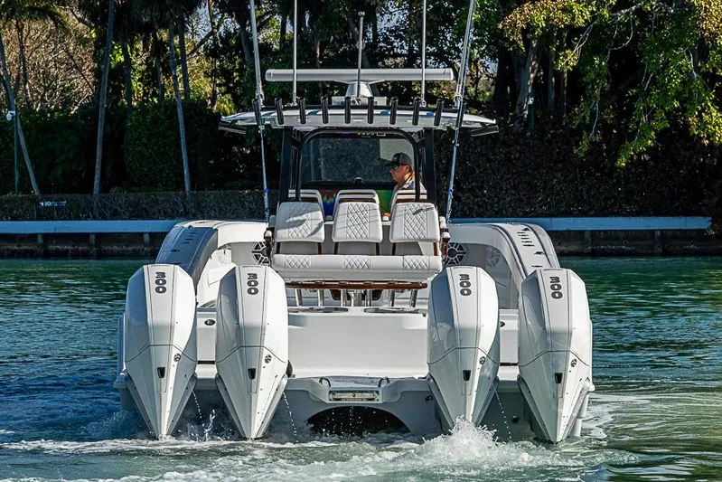  Yacht Photos Pics 2023 Freeman 47 boat with quad engines cruising on a scenic waterway.