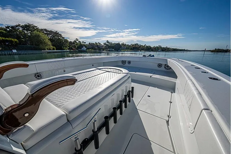  Yacht Photos Pics Luxurious 2023 Freeman 47 boat interior with elegant seating and scenic waterfront view.
