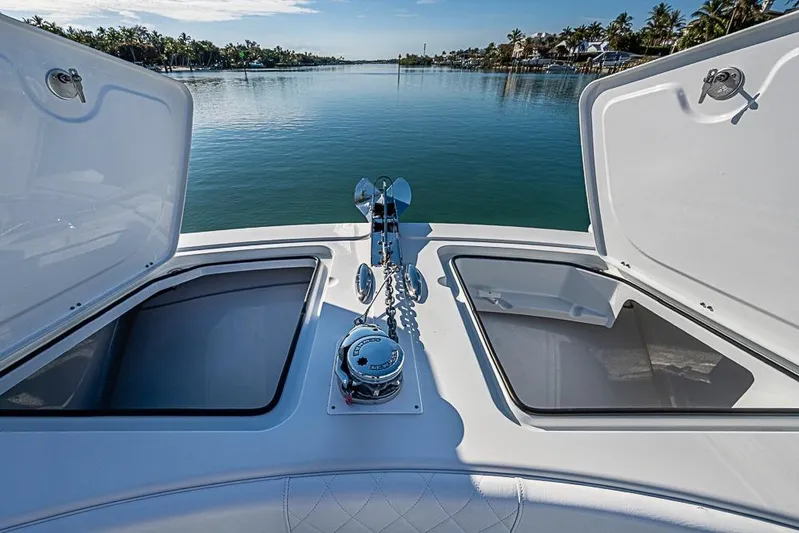  Yacht Photos Pics Bow view of 2023 Freeman 47 boat with open storage compartments and anchor chain.