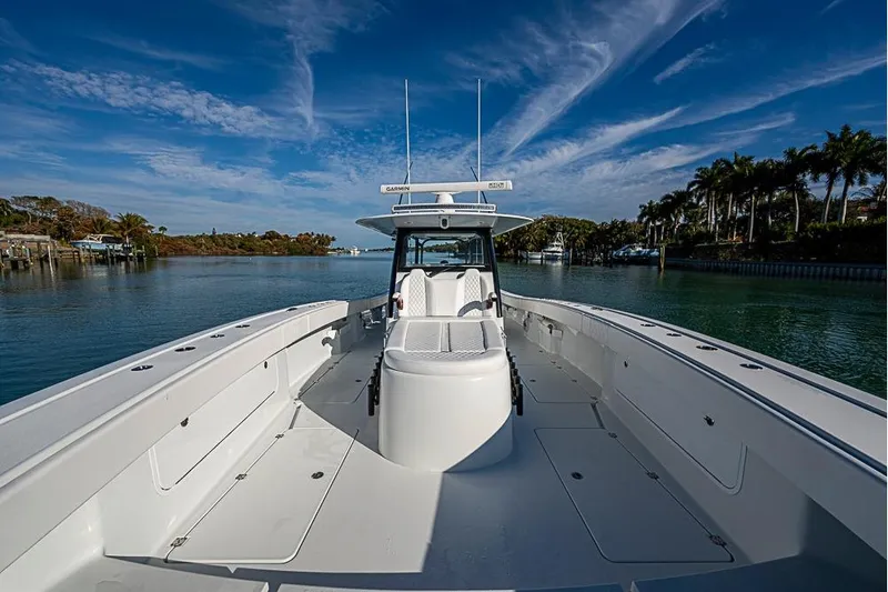  Yacht Photos Pics 2023 Freeman 47 boat on calm water under a clear blue sky.