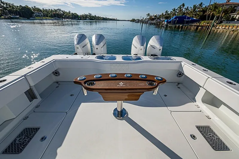  Yacht Photos Pics Freeman 47 boat deck with fishing station, 2023 model, on a serene waterway.