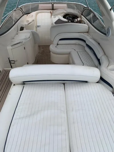  Yacht Photos Pics 1999 Sunseeker Superhawk 34 interior with white seating and wooden flooring.