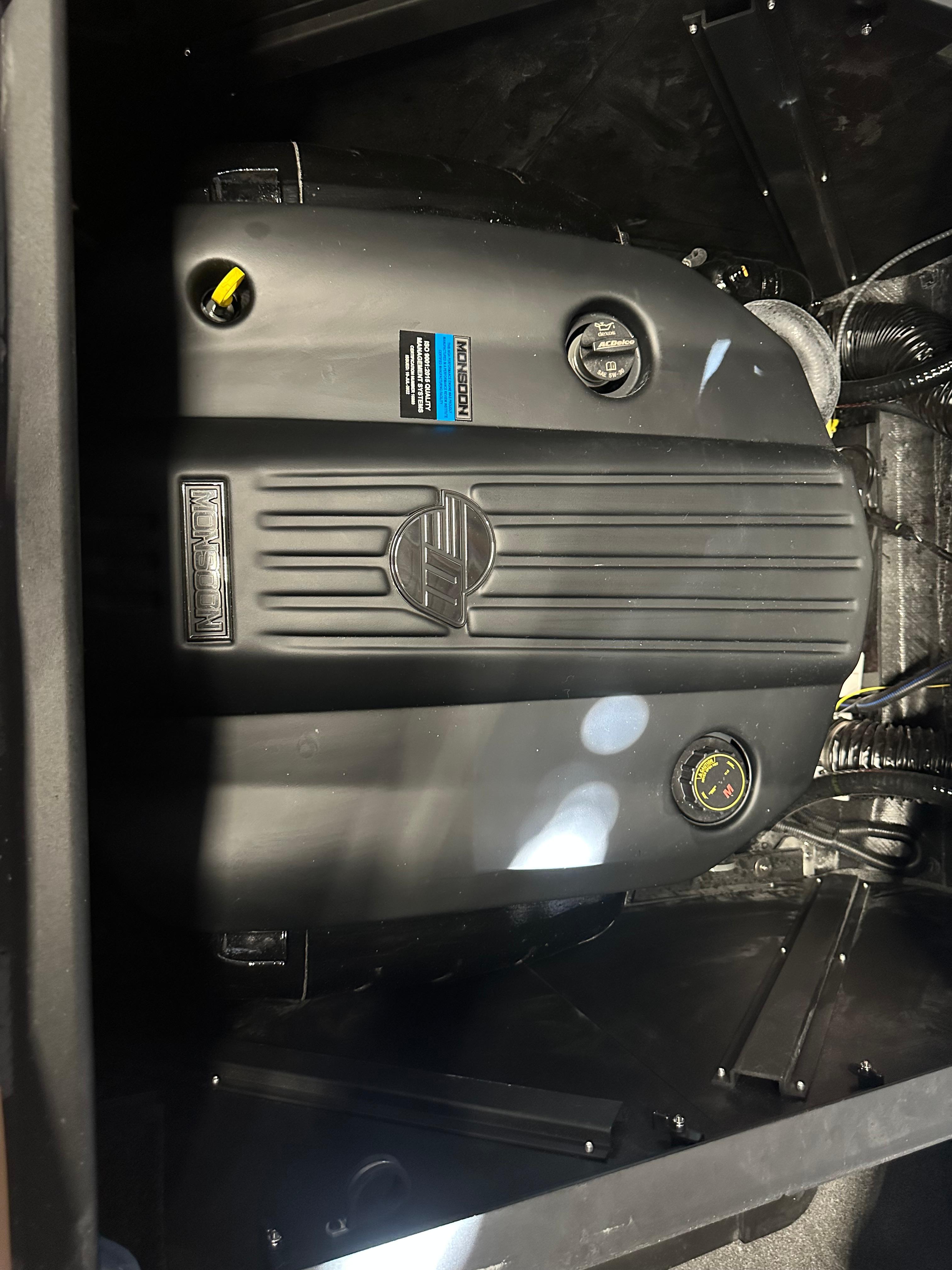 2025 Axis A245 engine compartment, showcasing a sleek black engine design.