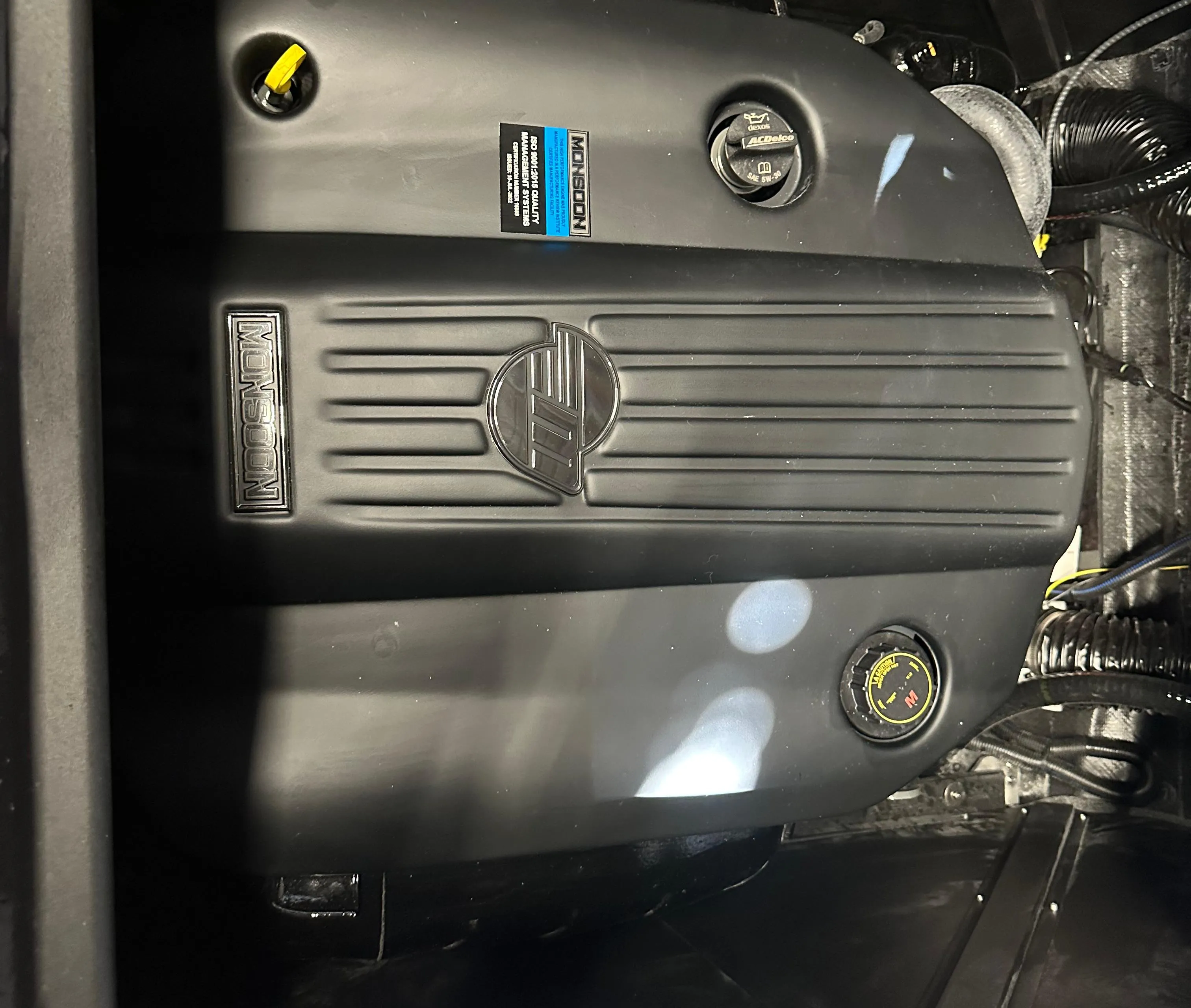 2025 Axis A245 engine compartment, showcasing a sleek black engine design.