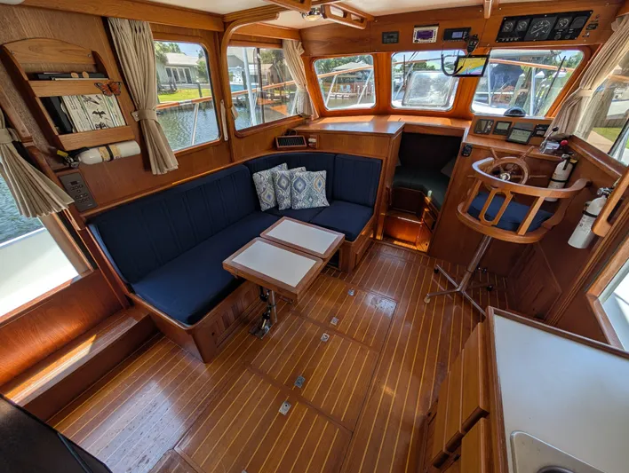 Monarch Yacht Photos Pics Cozy 1997 Monk 36 boat interior with wooden finish and blue seating.