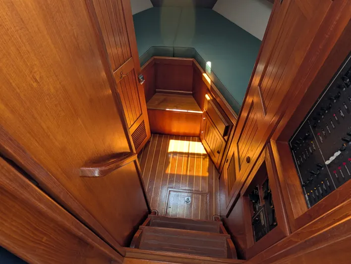 Monarch Yacht Photos Pics Interior of 1997 Monk 36 boat with wooden paneling and stairs.