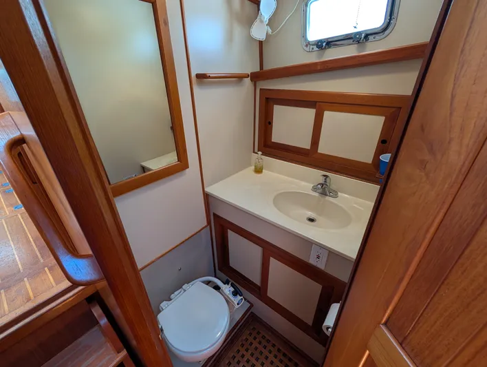 Monarch Yacht Photos Pics Bathroom interior of a 1997 Monk 36 boat, featuring wooden accents and compact design.