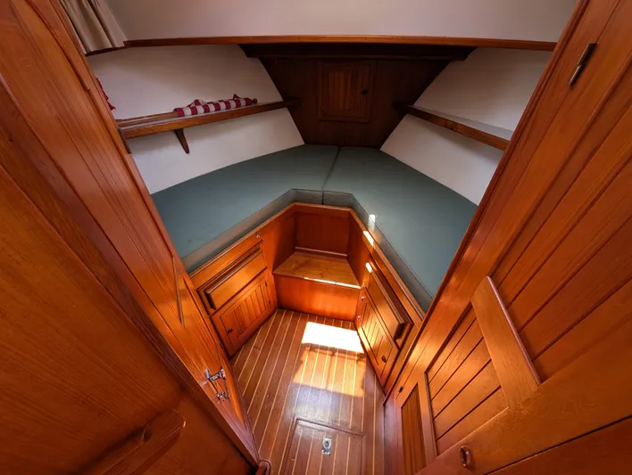 Monarch Yacht Photos Pics Cozy wooden cabin interior of 1997 Monk 36 boat with V-berth and storage.