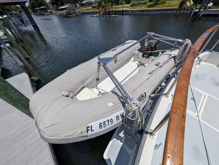 Monarch Yacht Photos Pics Inflatable boat docked beside a 1997 Monk 36 yacht on a sunny day.