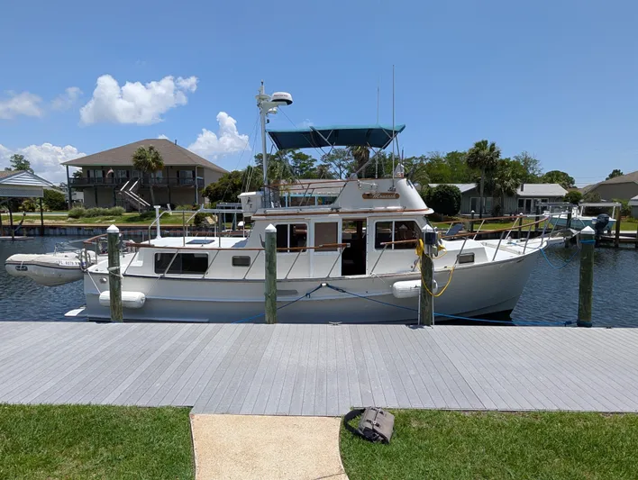 Monarch Yacht Photos Pics 1997 Monk 36 yacht docked at a marina under a clear blue sky.